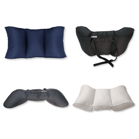 Vier lendekussens in verschillende kleuren: blauw, zwart, grijs en lichtbeige, sommige met bandjes